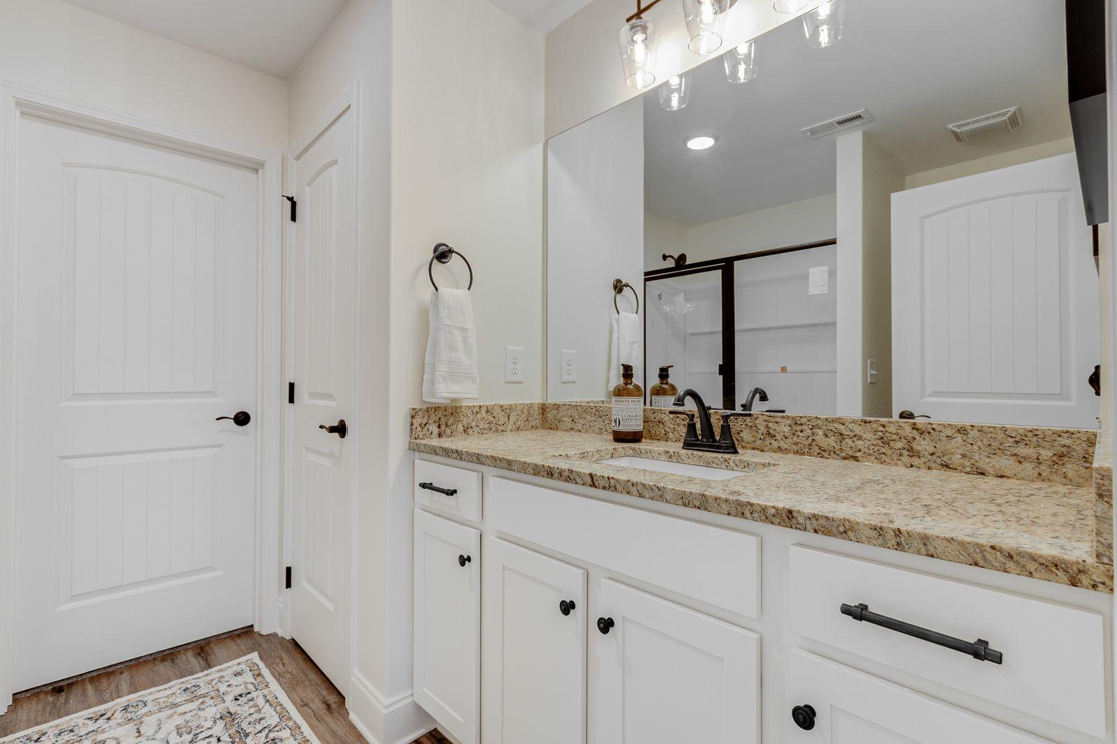 Preston Park guest bedroom with natural light and ceiling fan