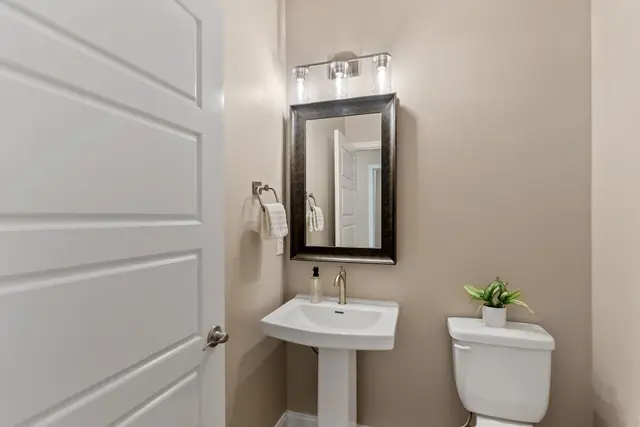 Green Meadows modern bathroom with glass shower and premium fixtures